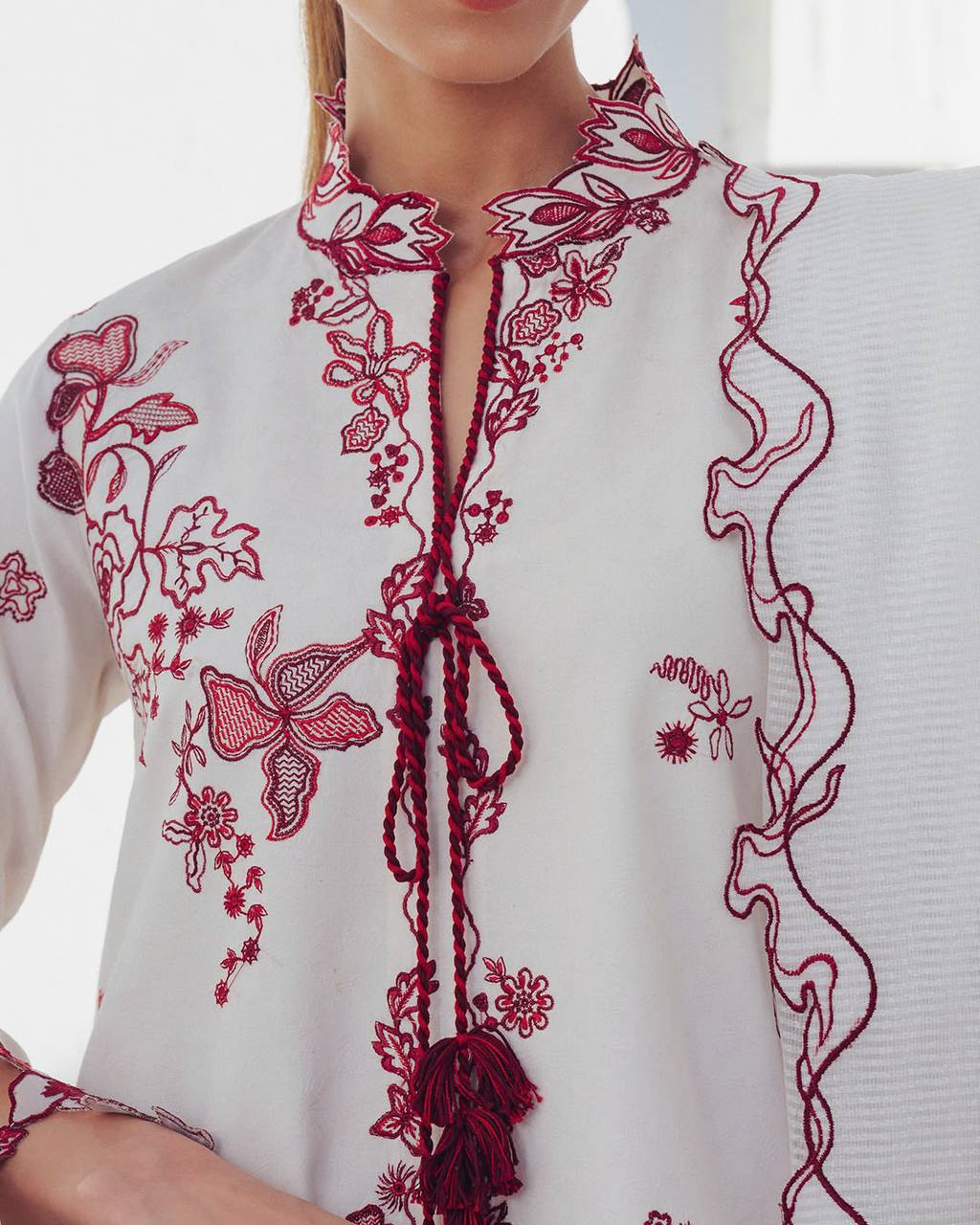 White Salwar Kameez - neck embroidery and tassel close-up